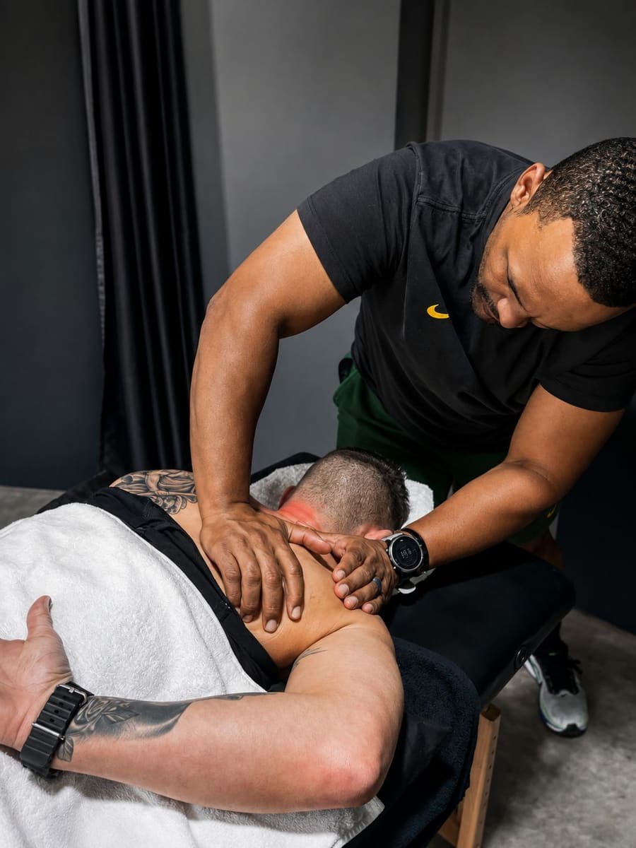 Robin JJ Williams treating a client at Maddog Performance Health and Wellness